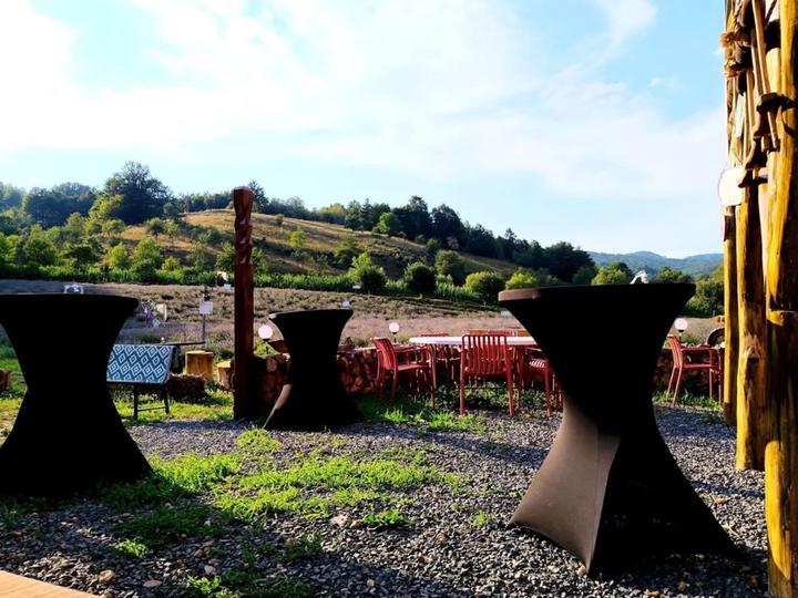 Standing tables on the terrace, looking out over the valley